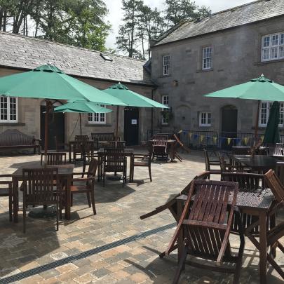 North Down Museum courtyard with tables and chairs.