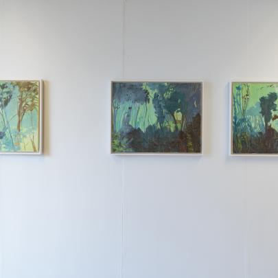 3 paintings on canvas on a wall