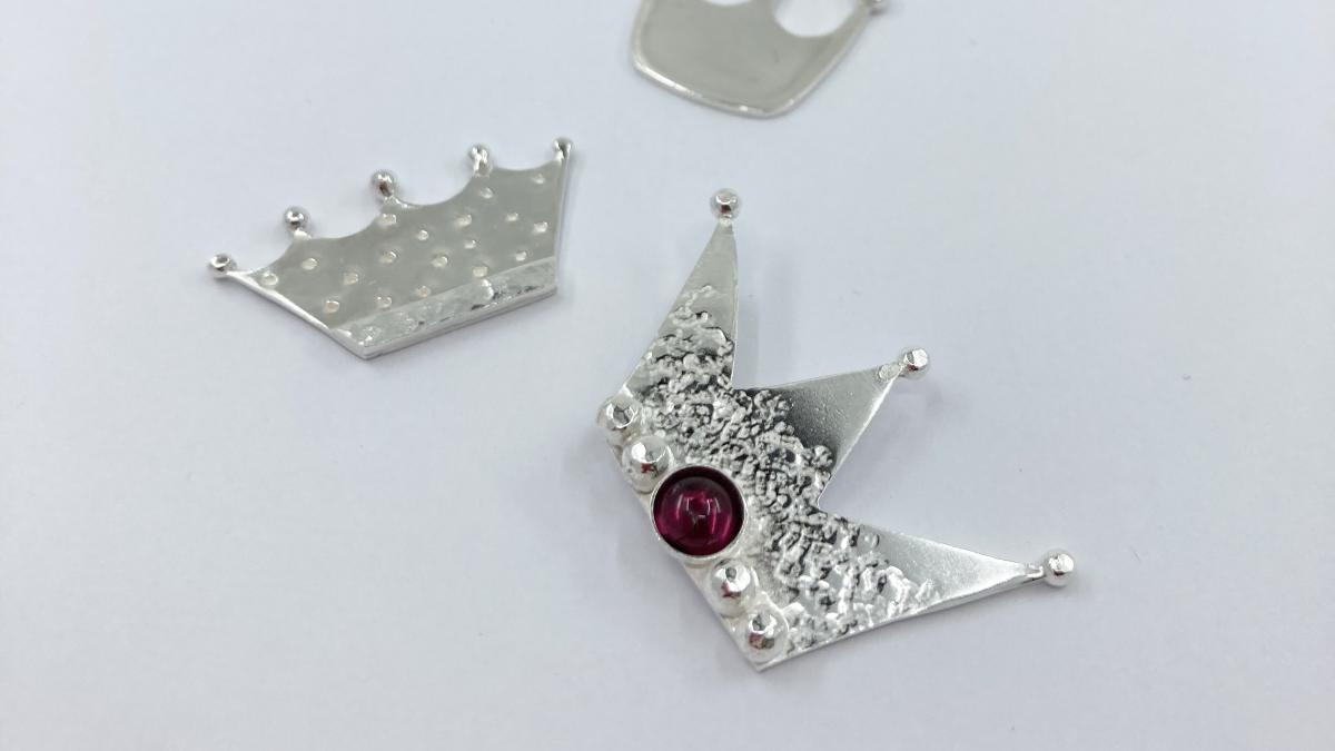 Image shows three Silver Crown jewellery pieces to celebrate Her Majesty's Platinum Jubilee