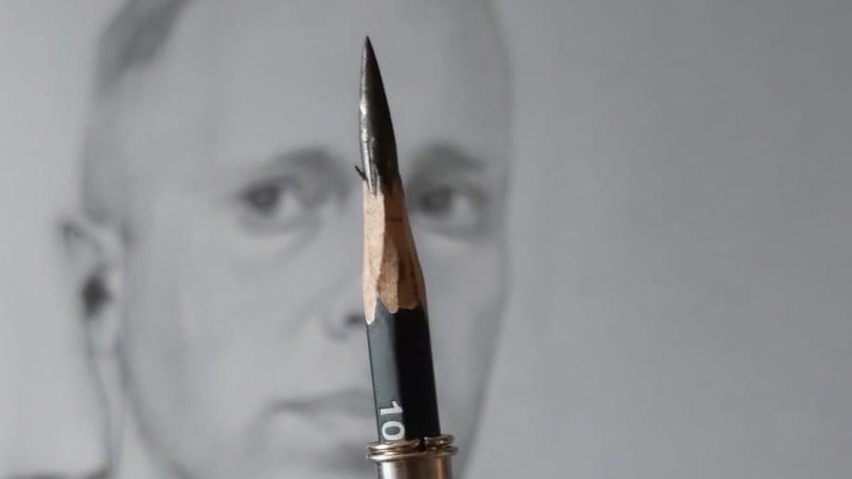 Pencil in front of a portrait