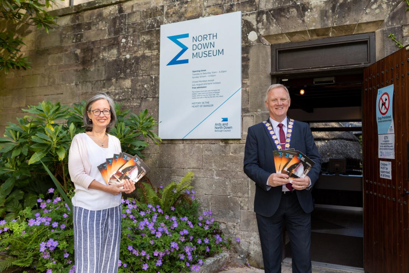 Museum Manager and The Mayor standing outside the museum's front door.